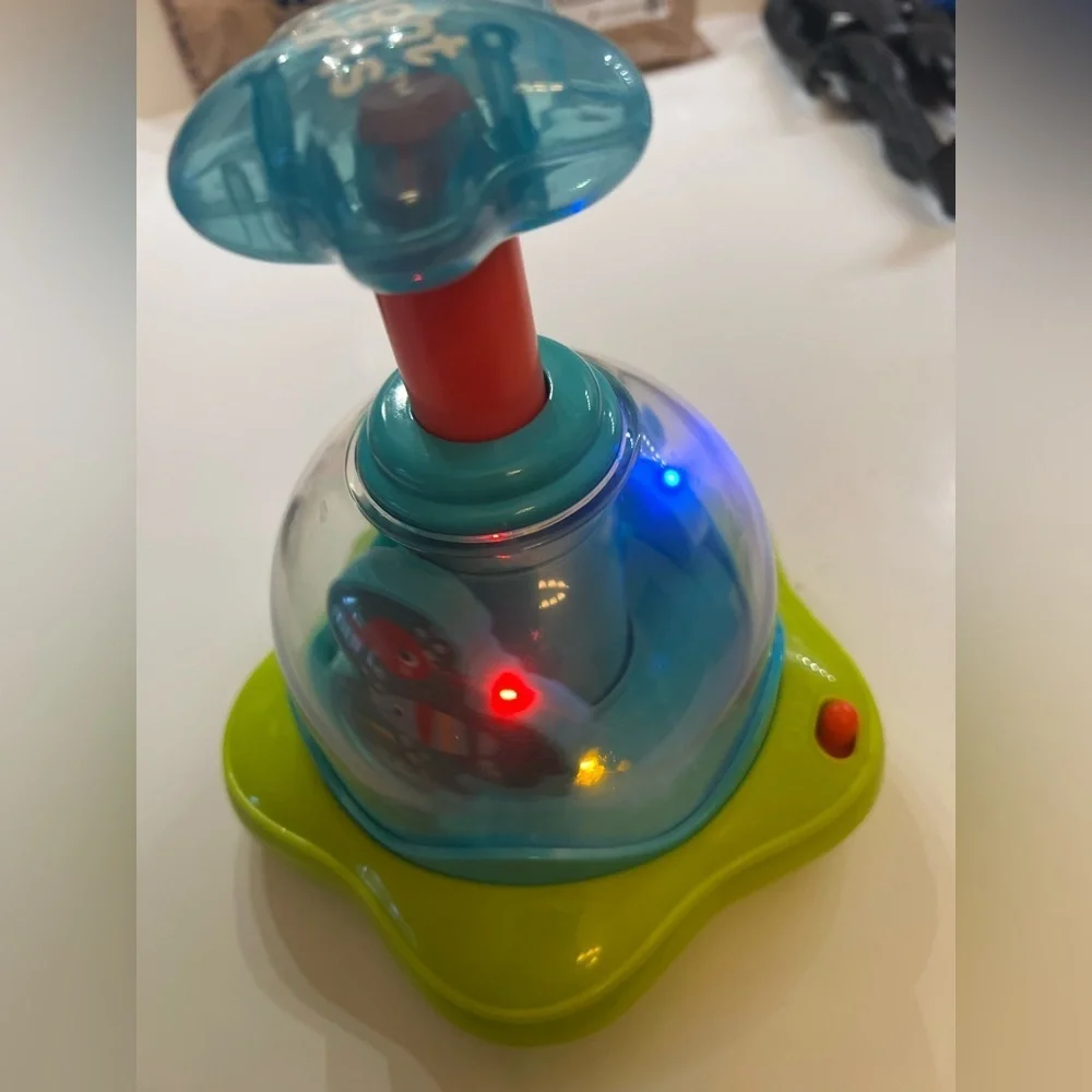 BRIGHT STARS PRESS AND GLOW SPINNER.  EVERY PUSH MAKES THE STARS GLOW